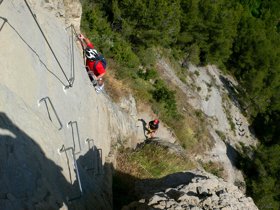 The vía ferrata starts with a long vertical section 