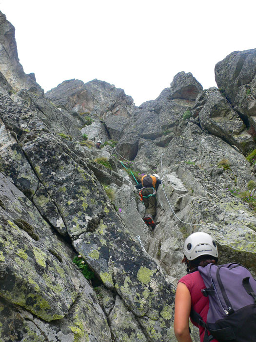 A 9-year-old boy climbs with his father 