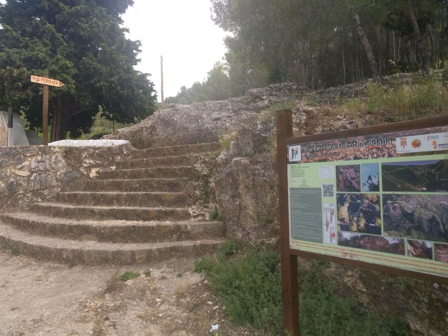 Informative poster of the via ferrata and indicator next to the parking lot 