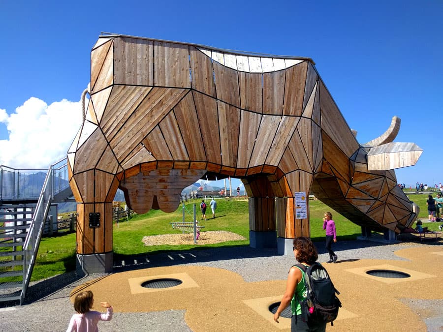 A big wooden cow marks the beginning of the path -its inside is a games zone and its tongue a long slide- 