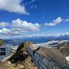 View of the Peak Walk walkway from the Scex Rouge summit -you can see the Quille du Diable in the background- / Hiking route Switzerland. Visit to a glacier in Les Diablerets 